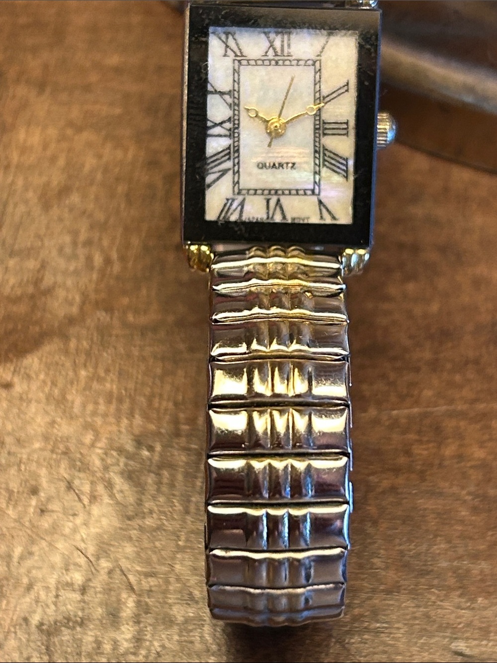 Classic Stainless Steel Women's Quartz Watch with Mother-of-Pearl Face.